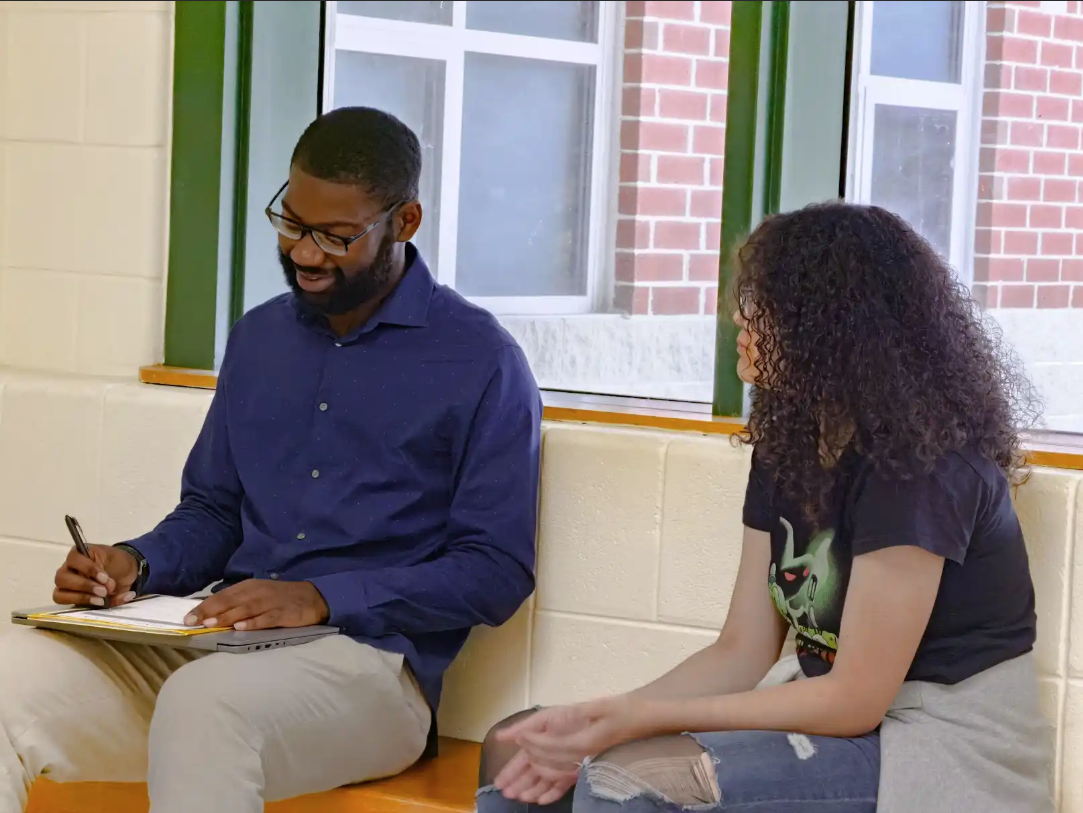 Teacher and student in discussion