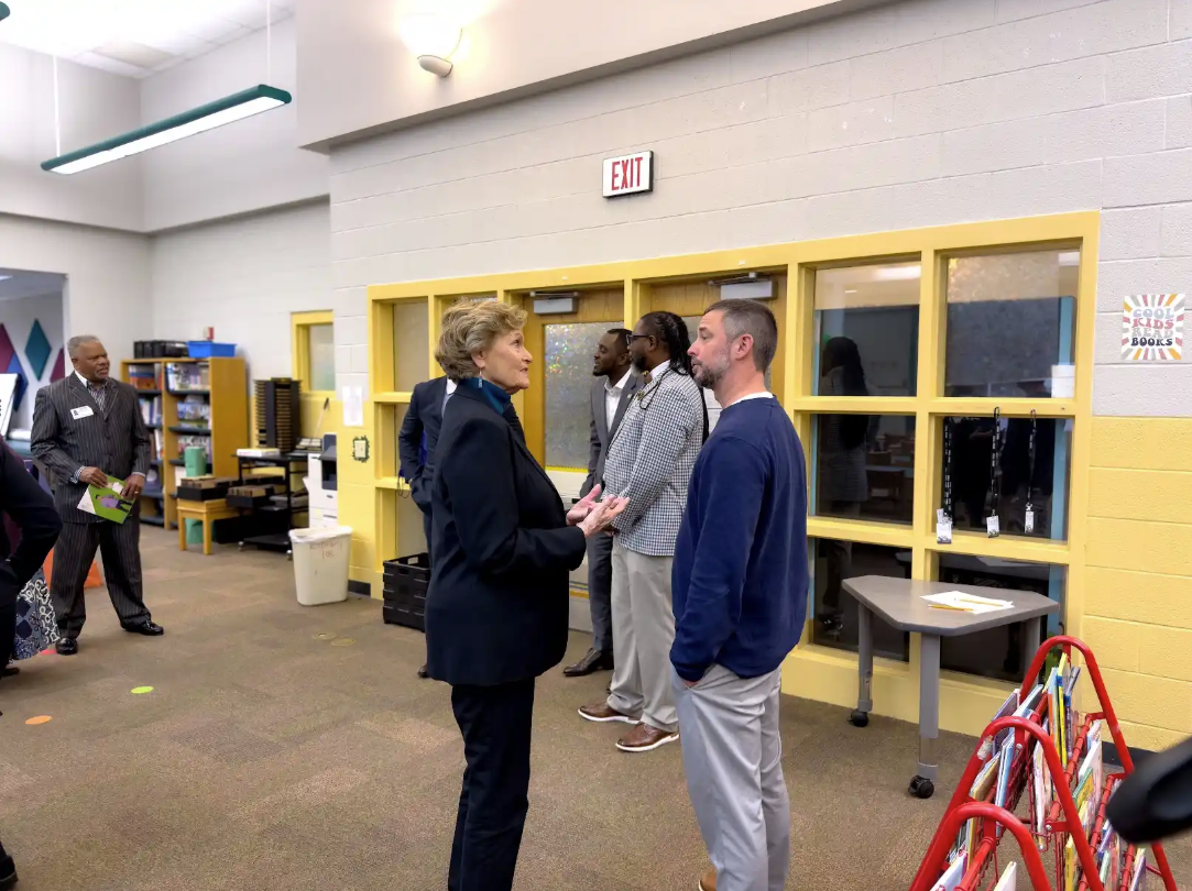 People engaging in conversation indoors